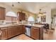 Spacious kitchen featuring stainless steel appliances, ample counter space, tile backsplash, and a breakfast bar at 1774 E Tyson St, Gilbert, AZ 85295