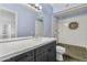 Updated bathroom with granite counters, large mirror, and mosaic tile in the stand up shower at 18223 N 20Th Pkwy, Phoenix, AZ 85023