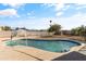 Clear blue pool with surrounding concrete and fencing at 18223 N 20Th Pkwy, Phoenix, AZ 85023