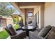 Inviting outdoor patio with comfortable seating, manicured lawn, and access to a charming courtyard at 18650 N Thompson Peak Pkwy # 1028, Scottsdale, AZ 85255