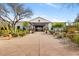 Front exterior of community clubhouse with landscaped walkway and desert flora at 18650 N Thompson Peak Pkwy # 1028, Scottsdale, AZ 85255