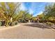 Community entrance with beautifully landscaped roundabout at 18650 N Thompson Peak Pkwy # 1028, Scottsdale, AZ 85255
