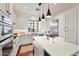 Stylish bright kitchen featuring white cabinets, stainless steel appliances, and kitchen island with seating at 18650 N Thompson Peak Pkwy # 1028, Scottsdale, AZ 85255