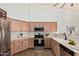 Kitchen featuring stainless appliances, tile backsplash, and ample counter space at 2033 E Tecoma Rd, Phoenix, AZ 85048