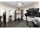 Home gym featuring various equipment and rubber flooring at 20921 E Carriage Way, Queen Creek, AZ 85142