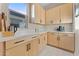 A kitchen nook with natural light, light countertop, wood cabinets and drawers, and stainless steel appliances at 20921 E Carriage Way, Queen Creek, AZ 85142