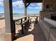 Outdoor bar seating offers picturesque views of the community lake and landscape at 23161 E Mockingbird Dr, Queen Creek, AZ 85142
