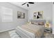 Stylishly staged bedroom with large bed, side tables and vibrant artwork creating an inviting retreat at 23161 E Mockingbird Dr, Queen Creek, AZ 85142
