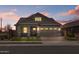 Charming single-story home with well-maintained landscaping, stone accents, and a paved driveway at 23161 E Mockingbird Dr, Queen Creek, AZ 85142