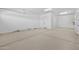 Spacious two-car garage featuring a clean and minimal design with ample space for vehicles and storage at 23161 E Mockingbird Dr, Queen Creek, AZ 85142