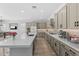 Well-appointed kitchen features a spacious center island, quartz countertops and backsplash at 23161 E Mockingbird Dr, Queen Creek, AZ 85142