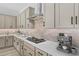 Well-equipped kitchen featuring stainless steel range hood and countertop espresso machine at 23161 E Mockingbird Dr, Queen Creek, AZ 85142