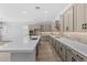 Large kitchen with gray cabinets, quartz countertops, and stainless steel appliances at 23161 E Mockingbird Dr, Queen Creek, AZ 85142