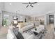 Open living area with kitchen and dining space, featuring modern furniture and wood floors at 23161 E Mockingbird Dr, Queen Creek, AZ 85142