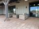 Comfortable outdoor seating area with fireplace, ideal for relaxing or entertaining guests at 23161 E Mockingbird Dr, Queen Creek, AZ 85142