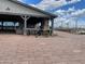 Outdoor pavilion with fireplace, bar, and seating provides a relaxing gathering space at 23161 E Mockingbird Dr, Queen Creek, AZ 85142
