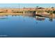 Picturesque pond with a small bridge and gazebo, providing a serene community space at 23161 E Mockingbird Dr, Queen Creek, AZ 85142