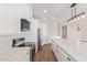 Kitchen featuring stainless steel appliances, recessed lighting, and an island with a marble countertop at 24032 W Redbird Rd, Wittmann, AZ 85361