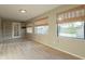 A bright and airy living room with lots of light from the many windows and built in shelves at 25822 S Boxwood Dr, Sun Lakes, AZ 85248