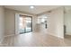 Neutral living room with light wood flooring and sliding doors overlooking the private patio at 25822 S Boxwood Dr, Sun Lakes, AZ 85248