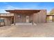 Exterior rear view showing private yard and the attached pergola at 27194 N Bear Paw Pass, San Tan Valley, AZ 85144