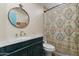 Charming bathroom with vanity, granite counters, and a patterned shower curtain for a stylish touch at 27194 N Bear Paw Pass, San Tan Valley, AZ 85144