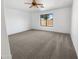 Bedroom with neutral walls, neutral carpet and a ceiling fan. Natural lighting at 29219 N Red Finch Dr, San Tan Valley, AZ 85143