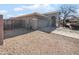 Exterior of home featuring a gravel yard and attached garage at 29219 N Red Finch Dr, San Tan Valley, AZ 85143
