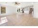 Bright living room features tile floors, neutral walls, a ceiling fan, and bright windows at 29219 N Red Finch Dr, San Tan Valley, AZ 85143