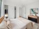 Bright bedroom with a modern platform bed, stylish dresser, and a closet with sliding doors at 29219 N Red Finch Dr, San Tan Valley, AZ 85143