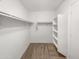 Walk in closet with shelving and racking with neutral colored carpet at 29219 N Red Finch Dr, San Tan Valley, AZ 85143