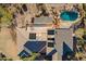 Aerial view of the backyard pool and spa and shows off the house and surrounding desert landscaping at 3086 N Herrala Way, Apache Junction, AZ 85119