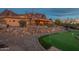Backyard putting green surrounded by desert landscaping, offering recreational space and mountain views at 3086 N Herrala Way, Apache Junction, AZ 85119
