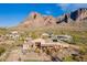 Great picture of the backyard pool, mountain views, putting green, and beautiful landscaping at 3086 N Herrala Way, Apache Junction, AZ 85119