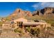 This elevation view shows off the large patio and backyard pool against a mountain backdrop at 3086 N Herrala Way, Apache Junction, AZ 85119