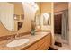 Bathroom featuring double sinks with granite countertop and framed oval mirrors at 3086 N Herrala Way, Apache Junction, AZ 85119