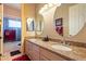 Bathroom featuring double sinks, granite countertops, and a separate tub and shower at 3086 N Herrala Way, Apache Junction, AZ 85119