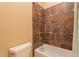 Bathroom featuring decorative tile in a shower and bathtub combination at 3086 N Herrala Way, Apache Junction, AZ 85119