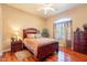 Cozy bedroom with hardwood floors, a large window, and a traditional style bed at 3086 N Herrala Way, Apache Junction, AZ 85119
