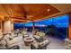 Extensive covered patio offering desert views, a wood ceiling, stone accents, and multiple seating areas at 3086 N Herrala Way, Apache Junction, AZ 85119
