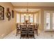Dining room with window views, wood table, and tile floors at 3086 N Herrala Way, Apache Junction, AZ 85119