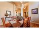 Dining room with wood table, chairs, and elegant decor at 3086 N Herrala Way, Apache Junction, AZ 85119
