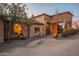 Gorgeous front exterior featuring desert landscaping, stone pathway, and stunning architecture that adds character to the residence at 3086 N Herrala Way, Apache Junction, AZ 85119
