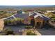 An exterior elevation view of the home showcasing the desert landscaping and beautiful neighborhood views at 3086 N Herrala Way, Apache Junction, AZ 85119