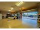 Spacious garage with ample lighting, a lift garage door, and desert views at 3086 N Herrala Way, Apache Junction, AZ 85119