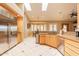 Kitchen features stainless steel appliances, light cabinets, and a dining area at 3086 N Herrala Way, Apache Junction, AZ 85119