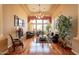 Bright living room with fireplace, high ceilings, large windows and wood floors at 3086 N Herrala Way, Apache Junction, AZ 85119