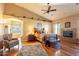 Spacious main bedroom featuring a fireplace, wood floors, and comfortable seating area at 3086 N Herrala Way, Apache Junction, AZ 85119