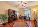 Office room with rich wood floors, a large window, and built-in shelving at 3086 N Herrala Way, Apache Junction, AZ 85119