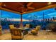 Outdoor patio area with stone fire pit and seating area, perfect for entertaining with sunset views at 3086 N Herrala Way, Apache Junction, AZ 85119